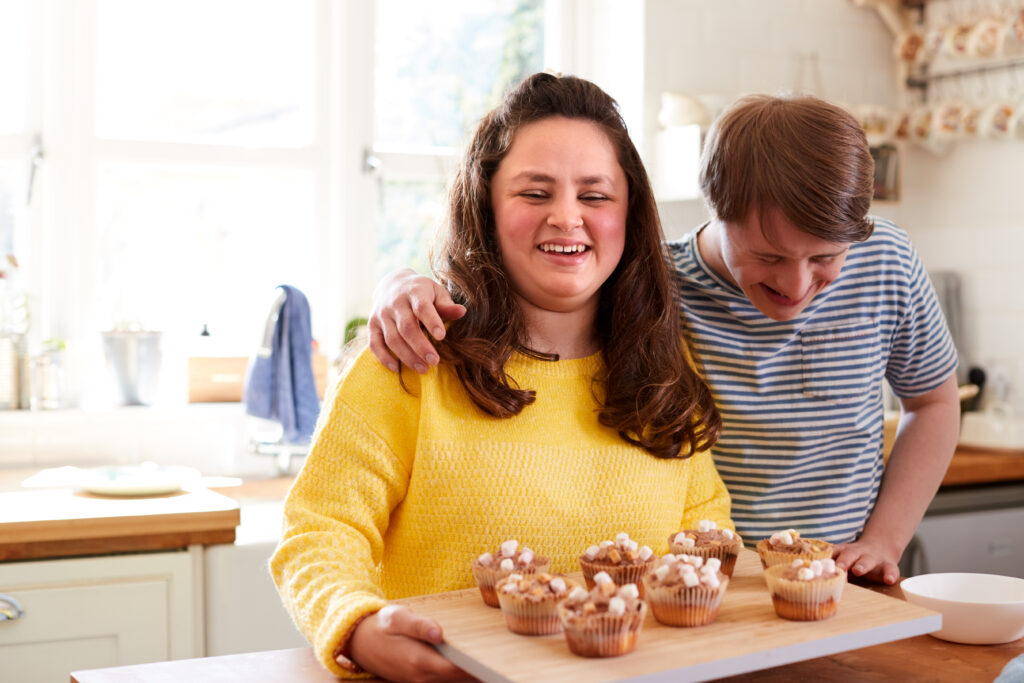 couple-baking-muffins-in-their-kitchen